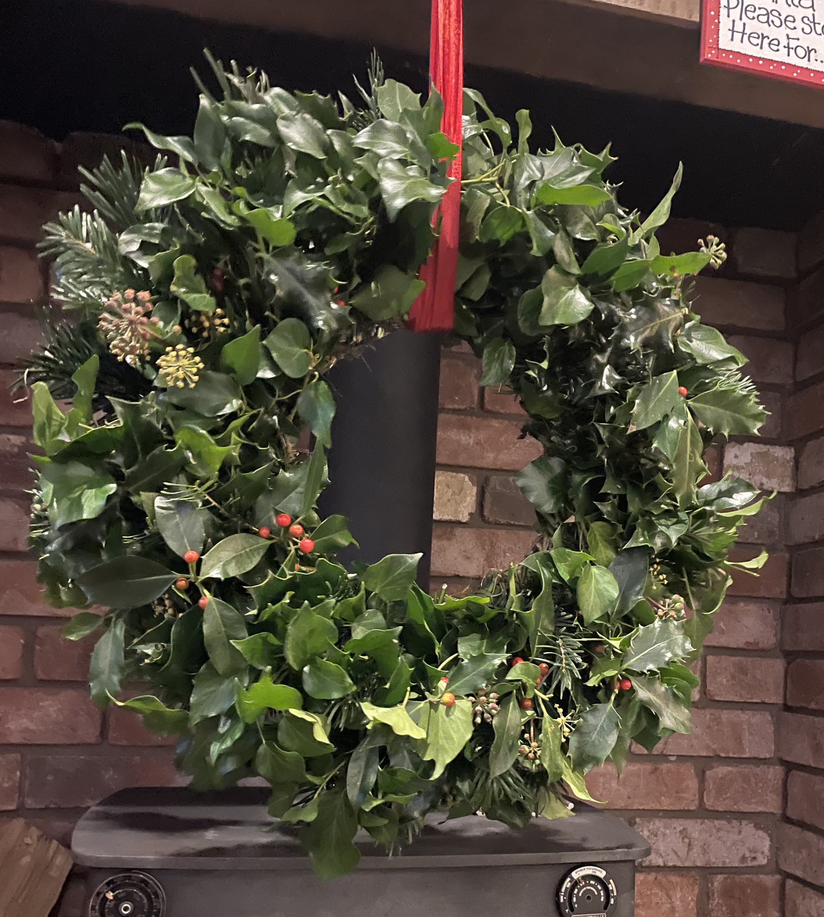 Fresh seasonal foliage prepared for a Christmas wreath-making workshop