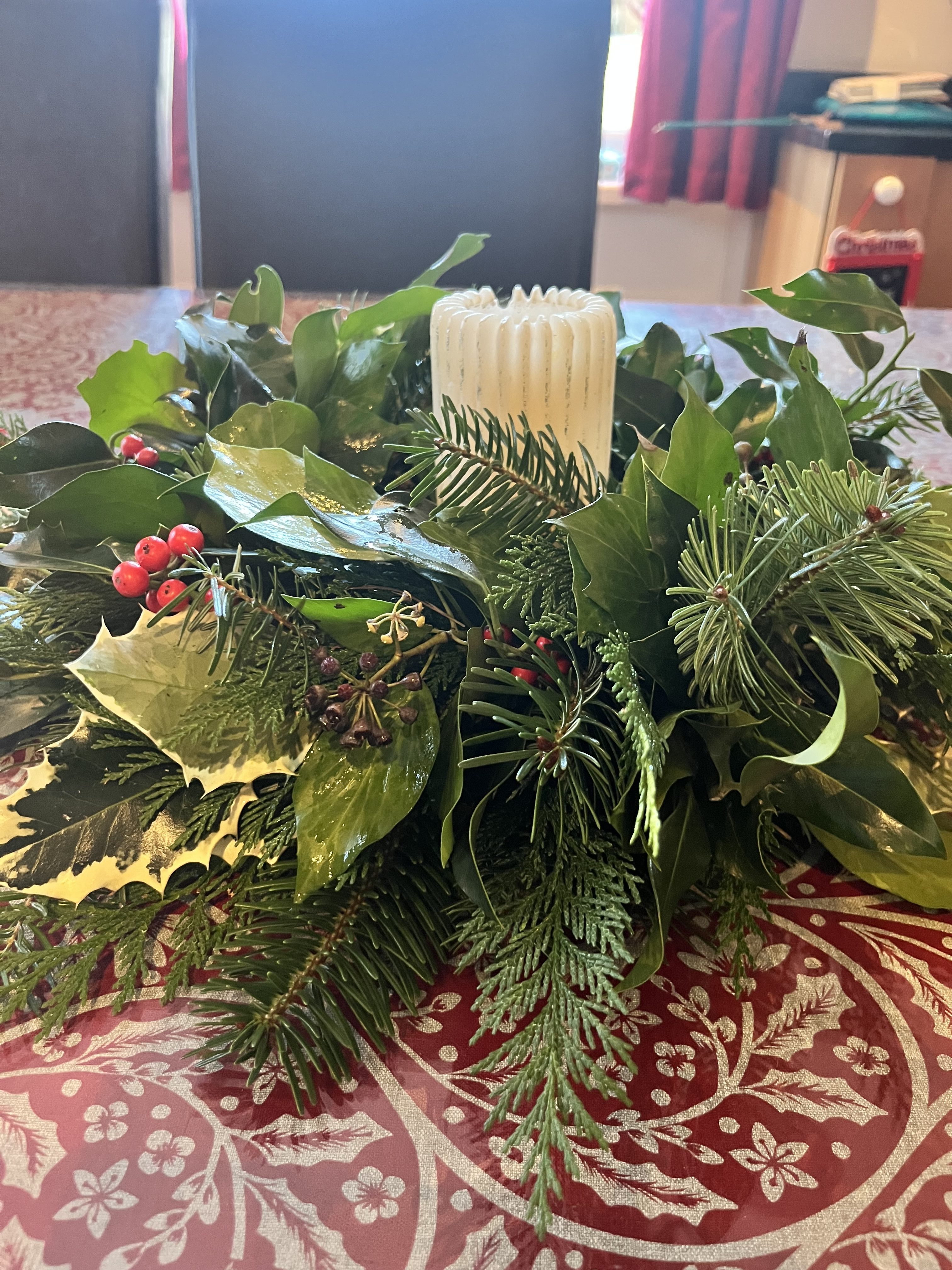 Fresh foliage Christmas table centrepiece